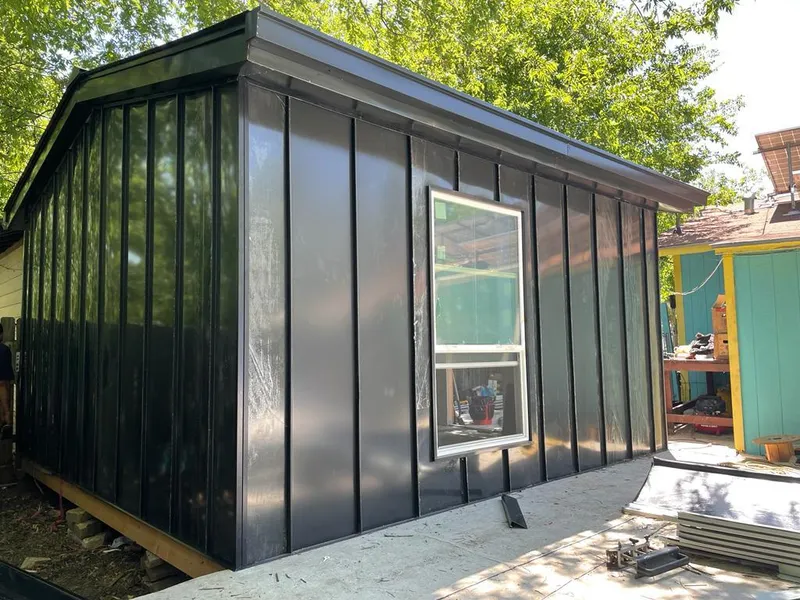 Black standing seam metal wall panels for Roof Inspection in Ithaca