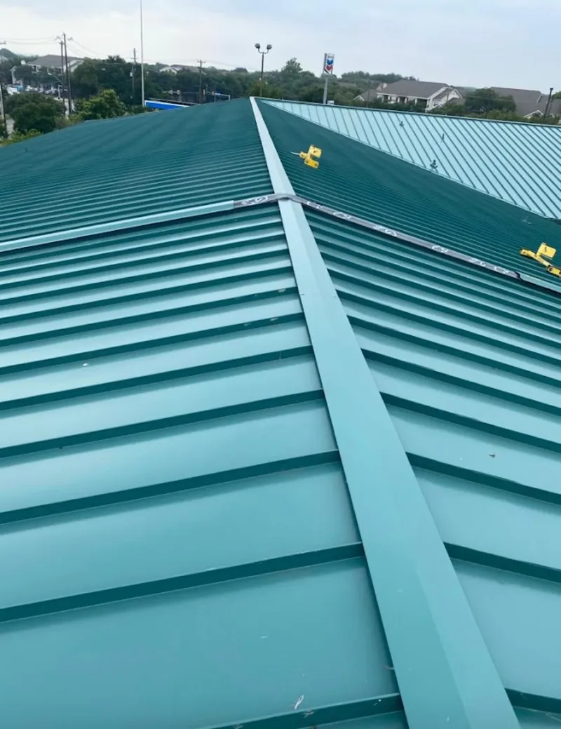 Green commercial metal roof ridge and valley for Metal Roof Repair in Ithaca